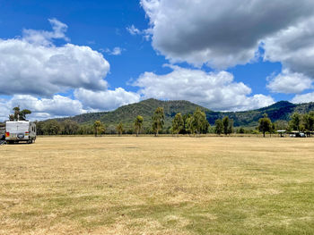 Scenic view of agricultural field against sky