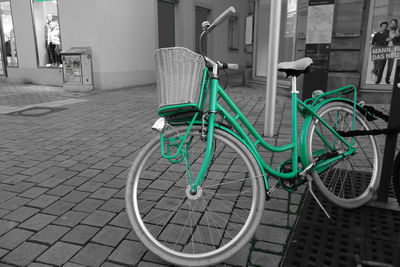 Bicycle parked on footpath in city