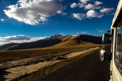 Road amidst mountains against sky