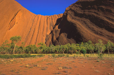 View of the landscape showing the southern side of uluru or ayers rock, early in the morning, 