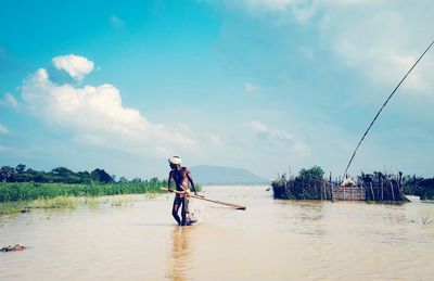 Full length of woman standing on jetty