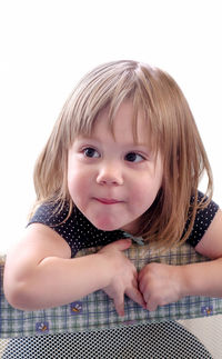 Portrait of a pretty little girl on a white background