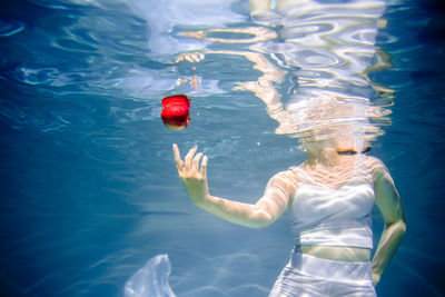 High angle view of woman swimming in pool