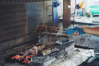 High angle view of people on barbecue grill