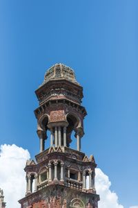 Low angle view of historic building against clear blue sky