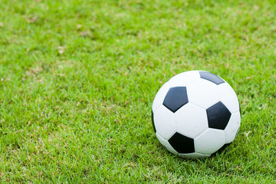 Close-up of soccer ball on grass