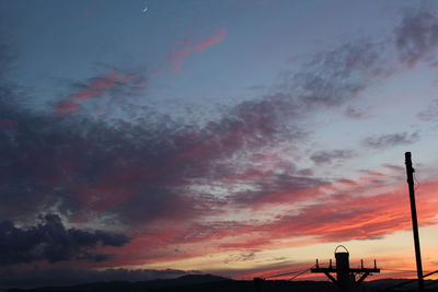 Low angle view of dramatic sky during sunset