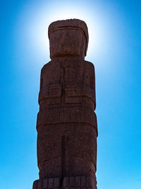 Low angle view of cross against blue sky