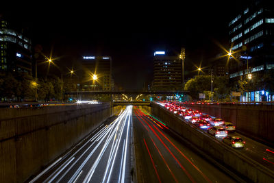 Light trails on road in city at night