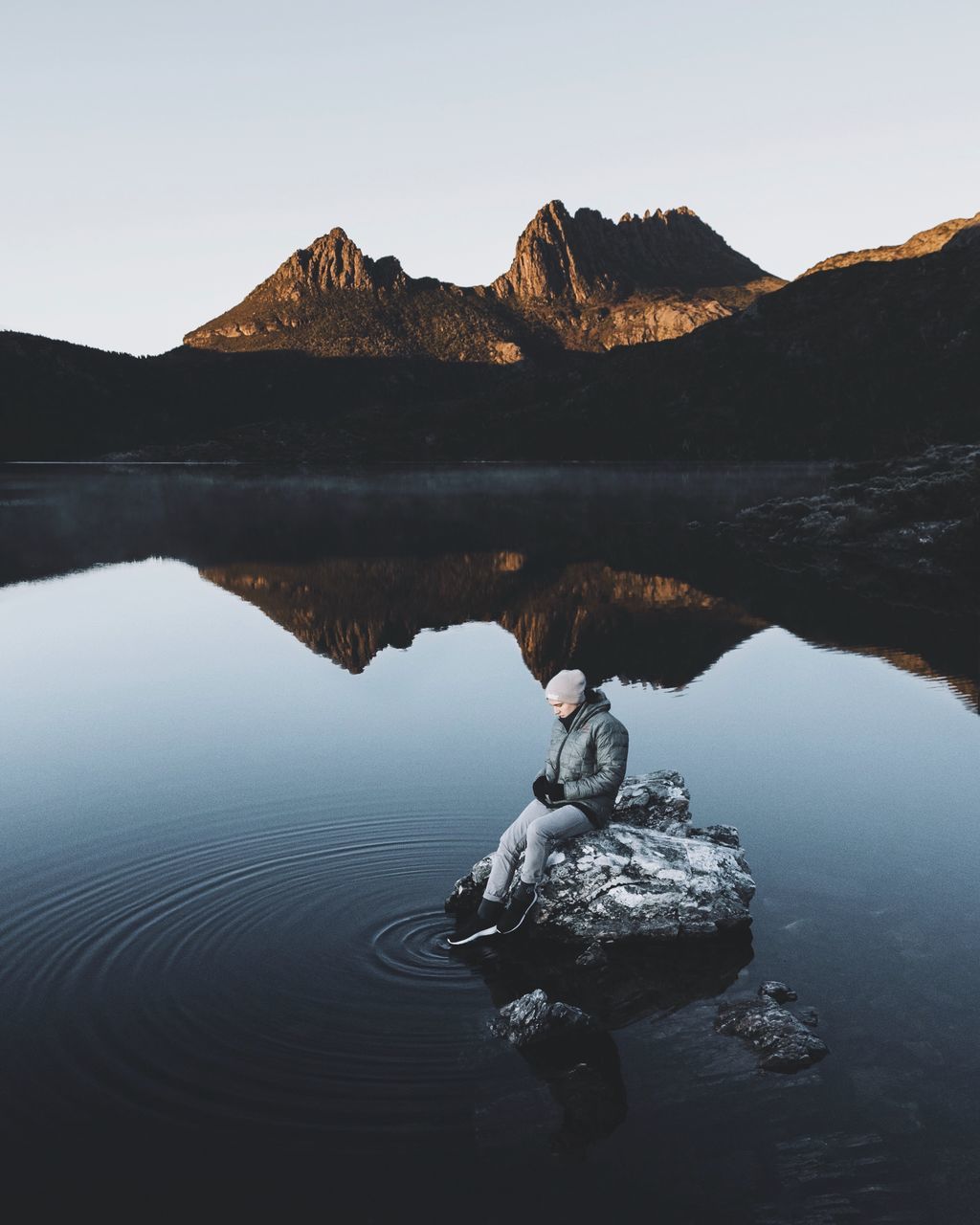 water, tranquility, mountain, tranquil scene, sky, beauty in nature, nature, lake, rock, scenics - nature, solid, rock - object, day, reflection, non-urban scene, mountain range, outdoors, clear sky, no people