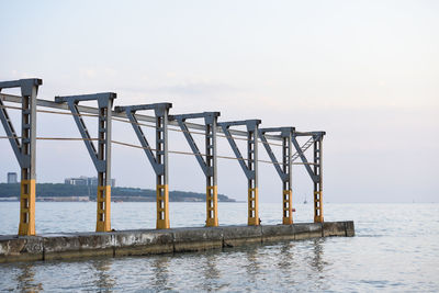 Pier over sea against sky