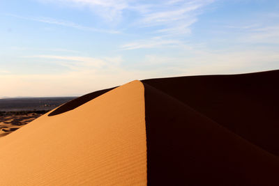 Close-up of sand dunes against sky