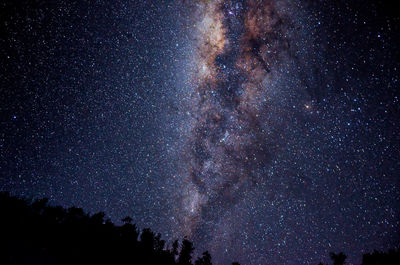 Low angle view of stars in sky at night