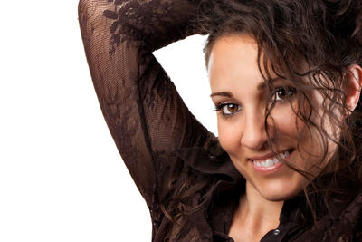 Portrait of a smiling young woman over white background