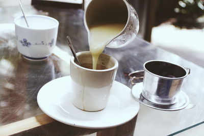 Close-up of coffee cup on table