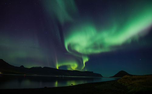 Scenic view of mountains against sky at night