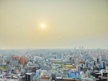 High angle view of buildings against sky during sunset