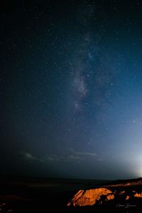 Scenic view of star field against sky at night