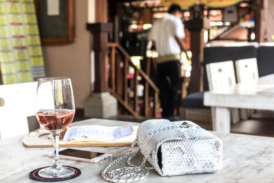 Close-up of wine glasses on table