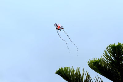 Low angle view of tree against clear blue sky