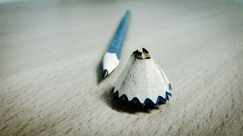 Close-up of pencil shaving on table