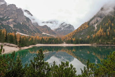 Scenic view of lake and mountains against sky