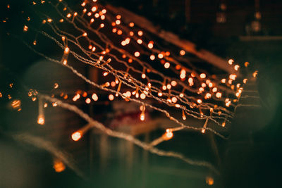 Close-up of illuminated lights in city at night