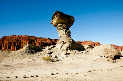 Rock formation on land against sky