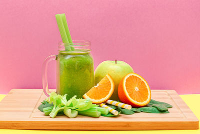 Green fruits on cutting board