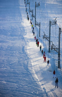 High angle view of people on snow and skilift