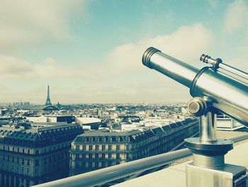 Cityscape against cloudy sky