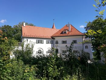 Houses in town against clear sky