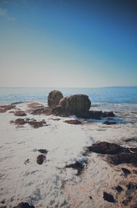 Scenic view of sea against clear blue sky