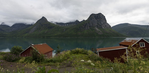 Scenic view of lake and mountains against sky