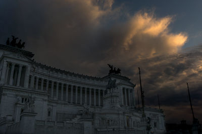 Low angle view of statue against cloudy sky