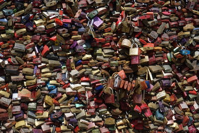 Close-up of padlocks hanging on railing