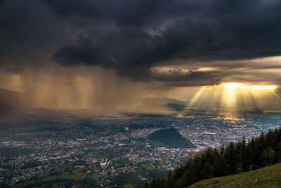 Aerial view of cityscape against sky during sunset