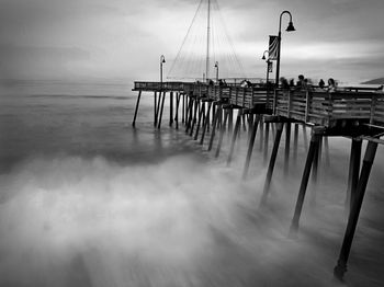 Pier on sea against sky