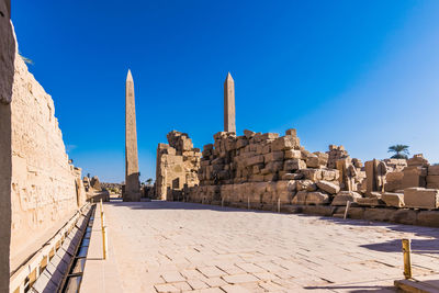 View of temple against clear blue sky