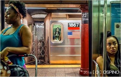 Woman sitting on train at subway station