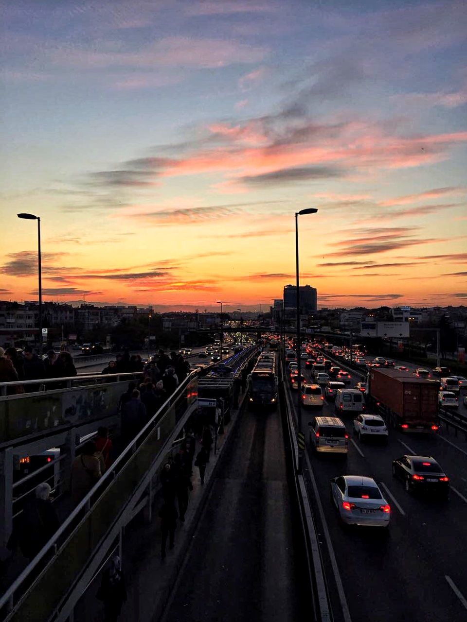 transportation, sunset, car, land vehicle, mode of transport, sky, built structure, architecture, traffic, no people, cloud - sky, road, city, building exterior, outdoors, nature, day