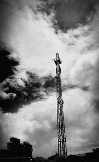 Low angle view of electricity pylon against sky