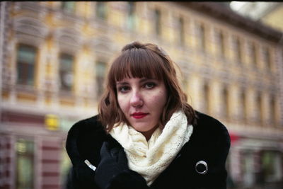Portrait of young woman standing outdoors