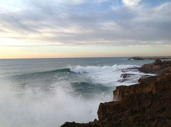 Scenic view of sea against dramatic sky