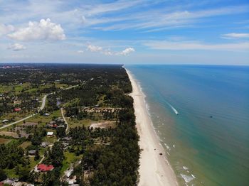 Aerial view of sea against sky in city