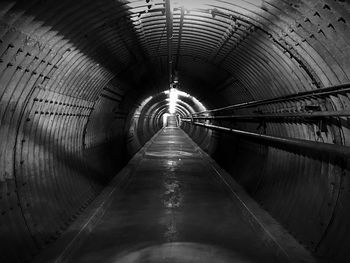 Empty illuminated subway tunnel