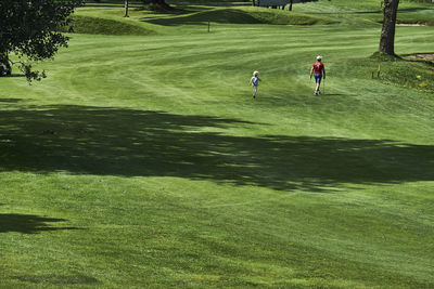 Father and son on golf course