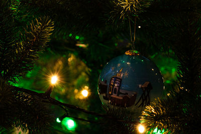 Illuminated christmas tree at night