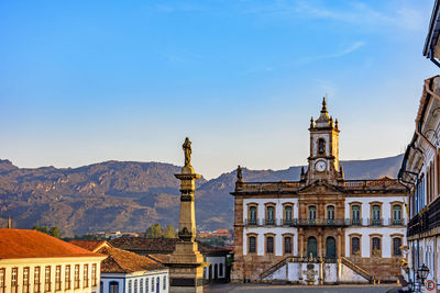 Central square of historic ouro preto city with colonial style buildings at sunset