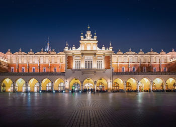 Illuminated buildings in city at night